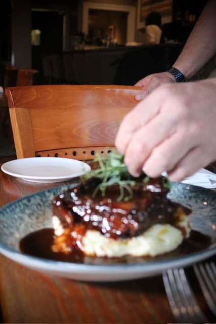 Chef Marc plating a seasonal dish