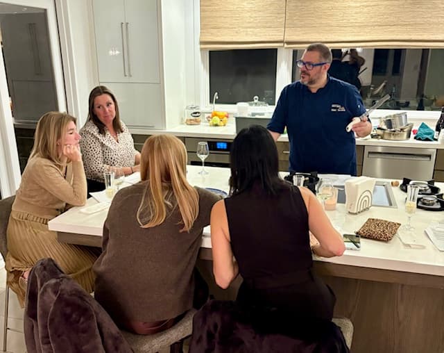 Chef Marc with guests at a culinary event